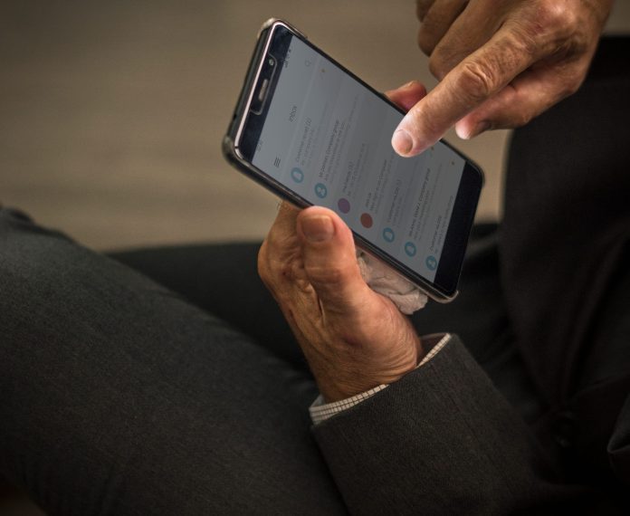 businessman-using-his-mobile-phone (1)